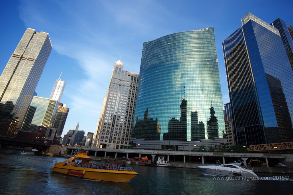 The building with the reflection is 333 West Wacker Drive, designed to follow the curve of the river