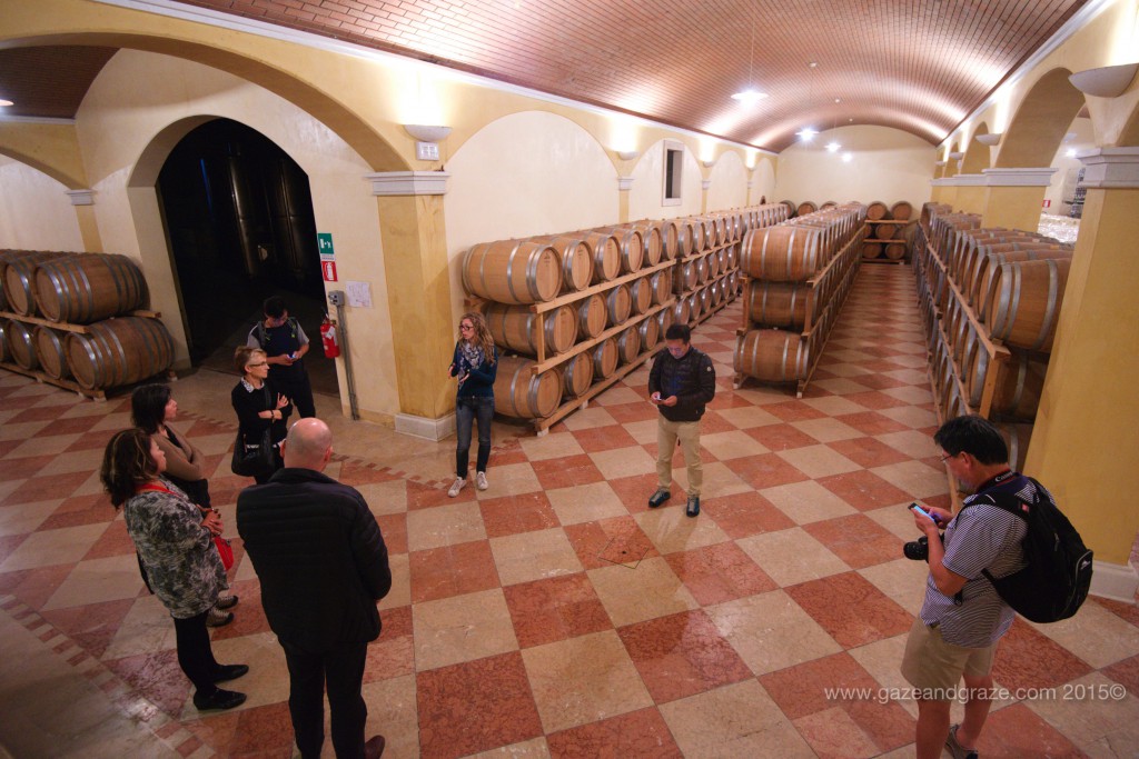 Nicolis' wine cellar with barrels of Amarone and Ripasso