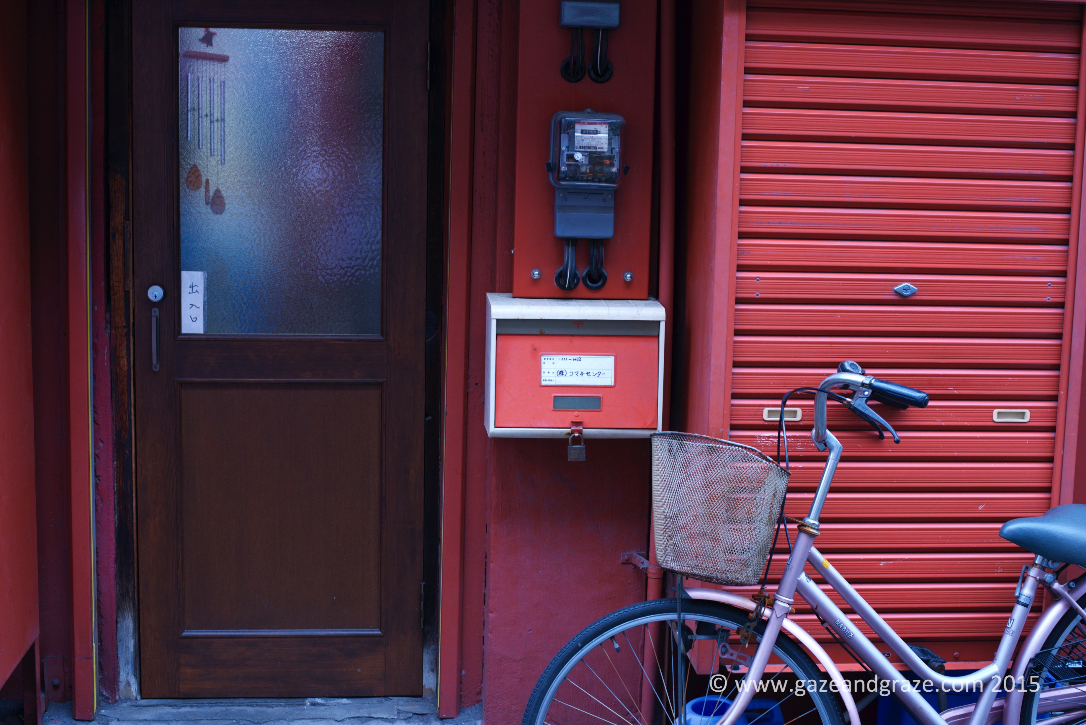 The back of the Kaminarimon street stores - the locked cabinet behind the bicycle holds inventory