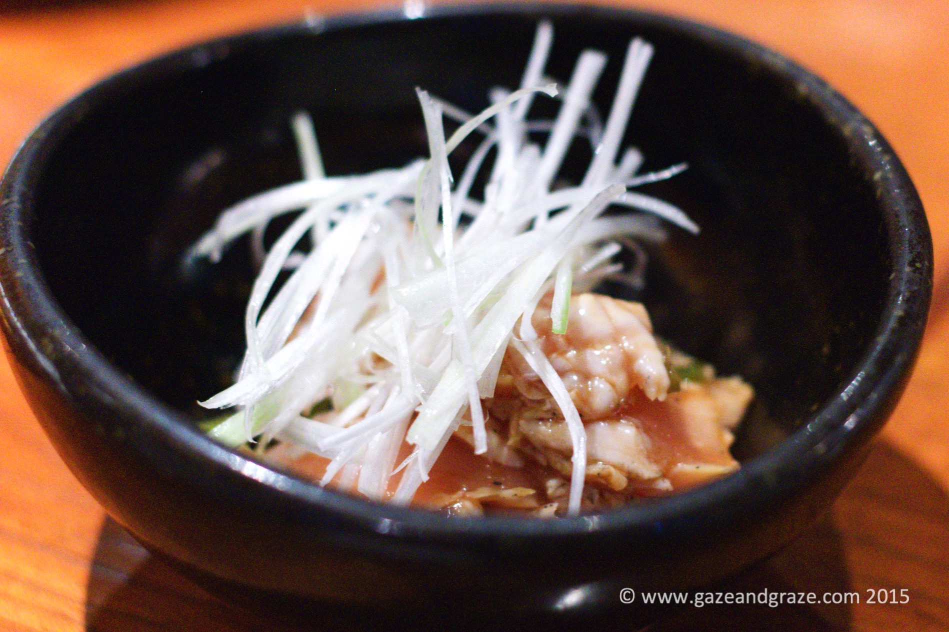Raw chicken with wasabi and spring onion