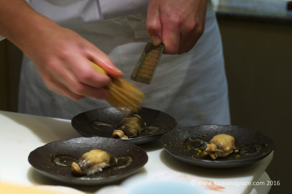 Preparing the clam sushi