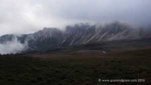 When the clouds lifted a bit, a glimpse of the surrounding mountains